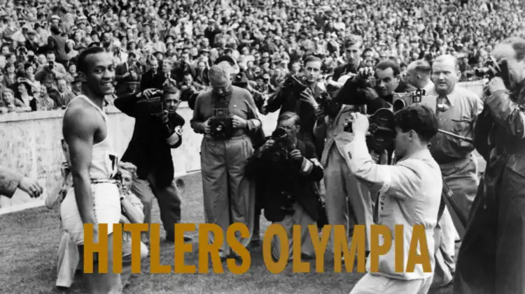 Ein Schwar weiß Foto von Jessie Owens der von Fotografen abgebildet wird. Unten im Text ist der Titel zu sehen.