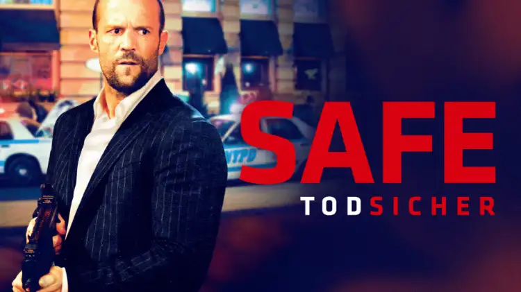 Plakat „Safe-Todsicher“ mit Jason Statham auf einer belebten Straße. In seinen Händne trägt er eine Waffe, der Titel ist in Rot gehalten.