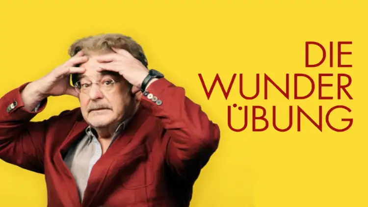 Plakat „Die Wunderübung“, Erwin Steinhauer als Eheberater Harald in einem Roten Anzug, hält sich verzweifelt die Hände am Kopf, der Titel ist rechts von ihm dargestellt.